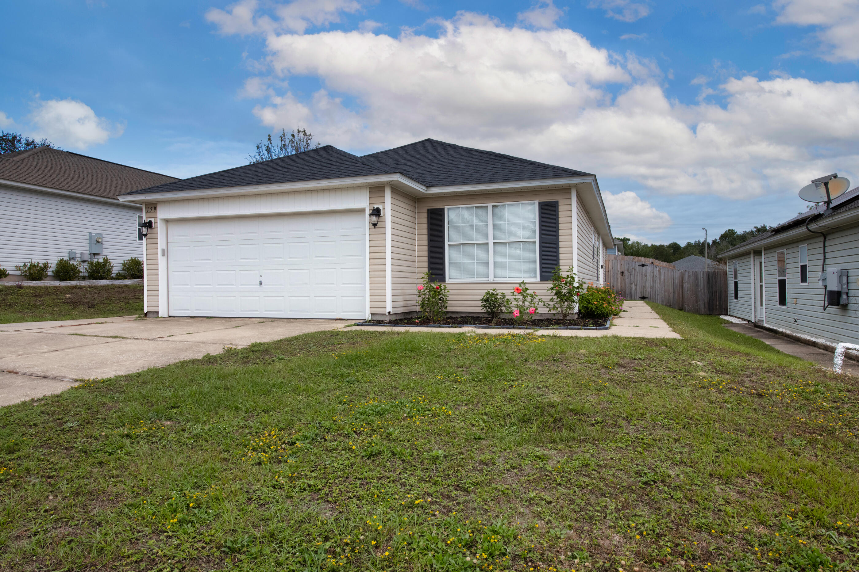 a backyard of a house with yard and garage