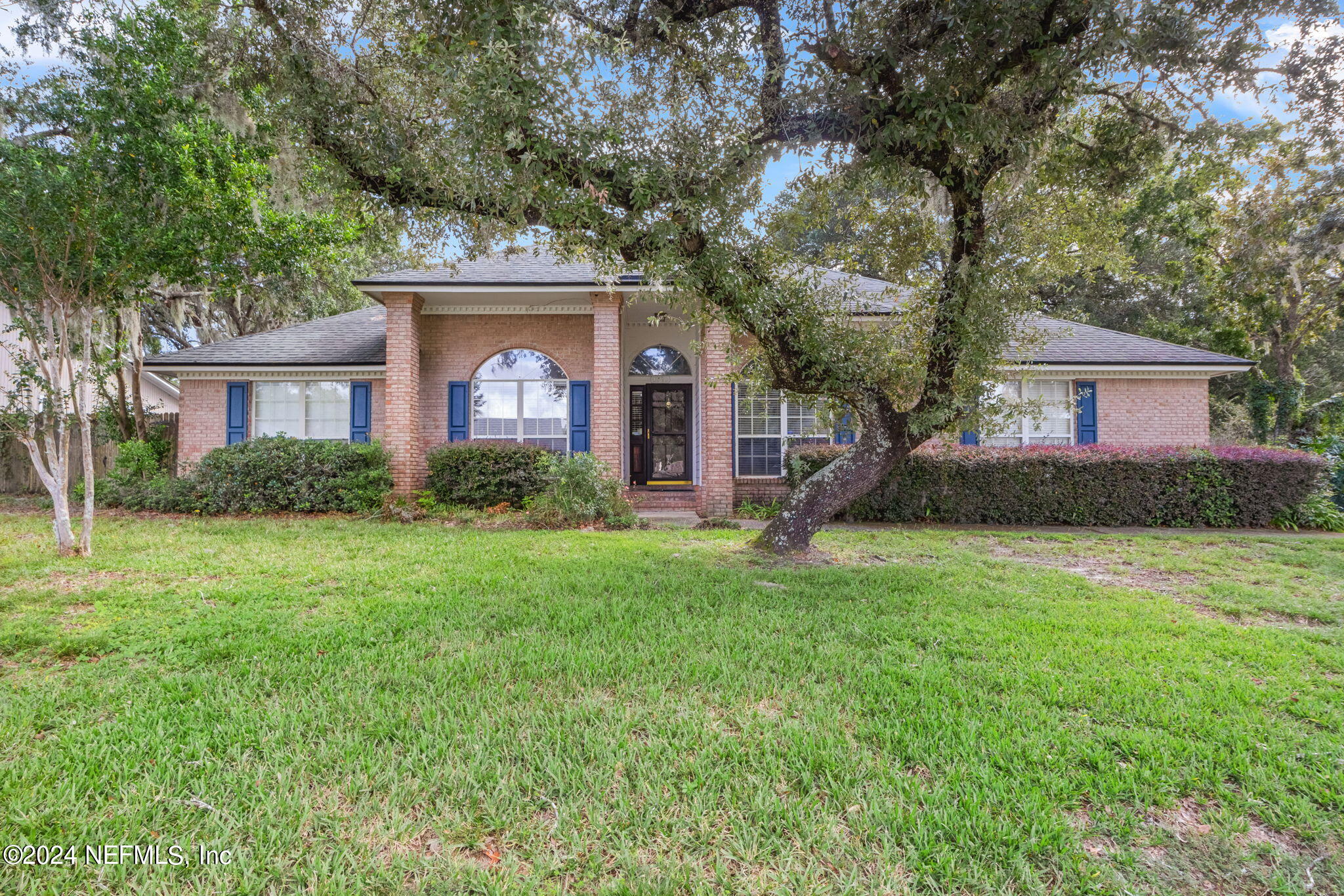 front view of a house with a yard