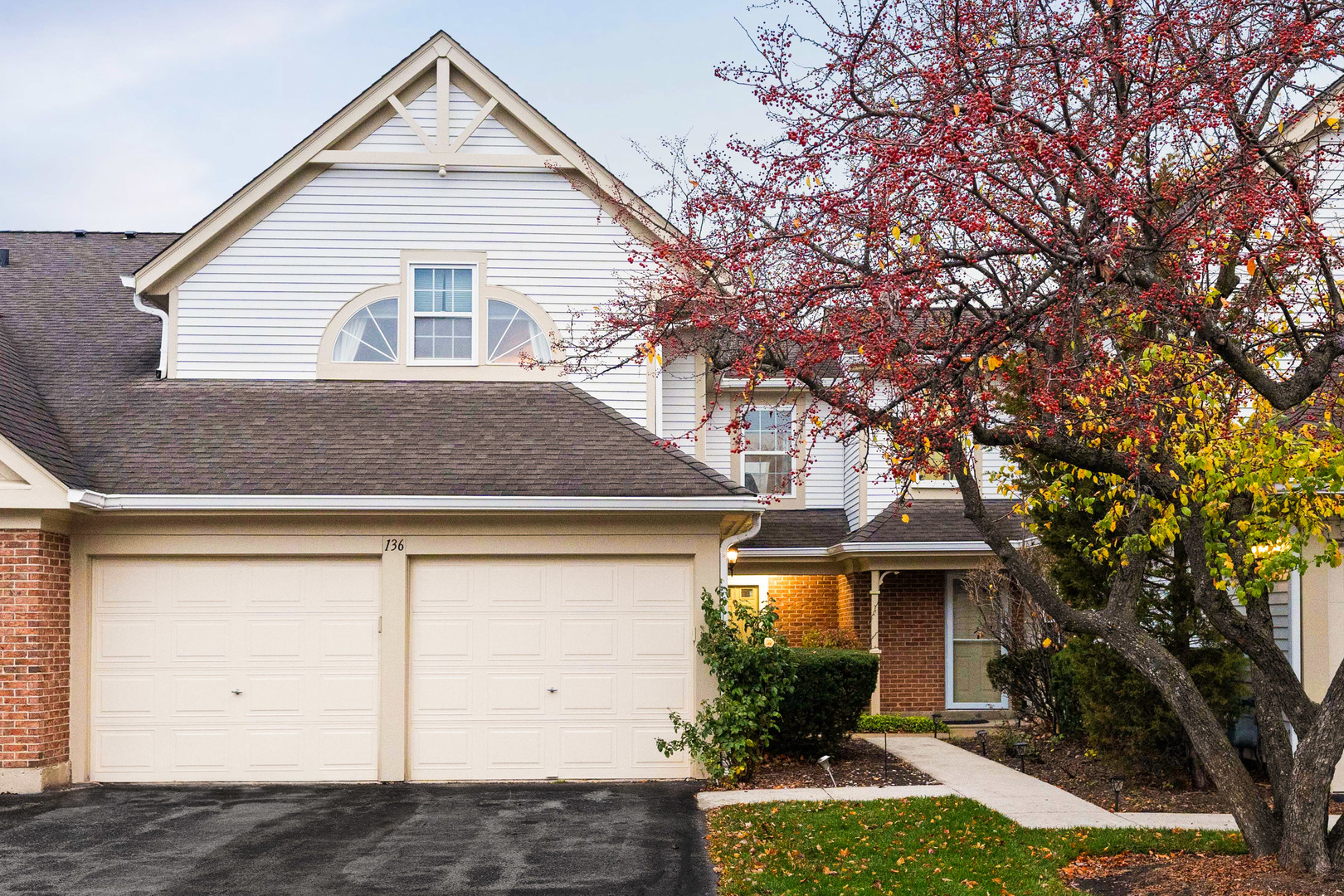 a front view of a house with a yard