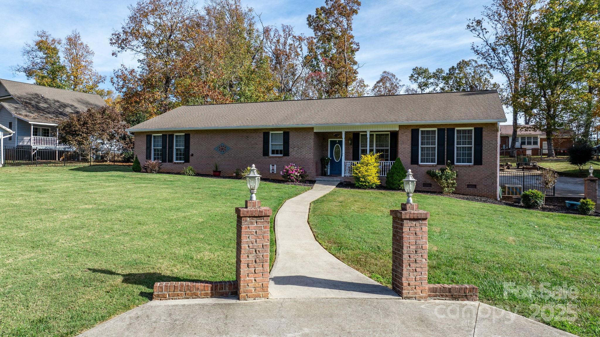 a front view of a house with garden and porch