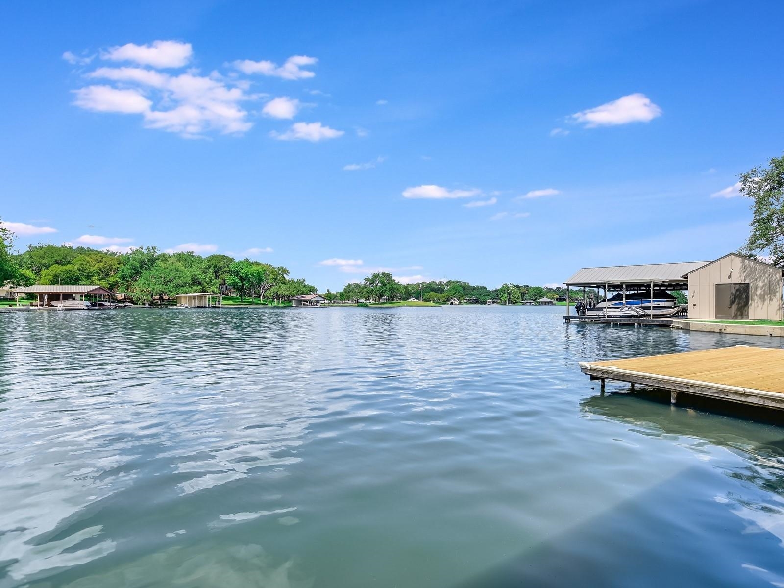 a view of a lake with houses in the back