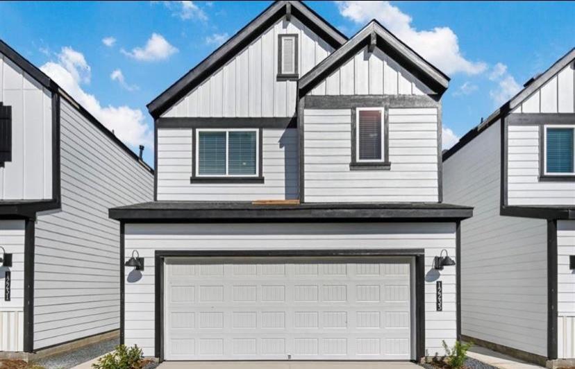 a view of house with garage