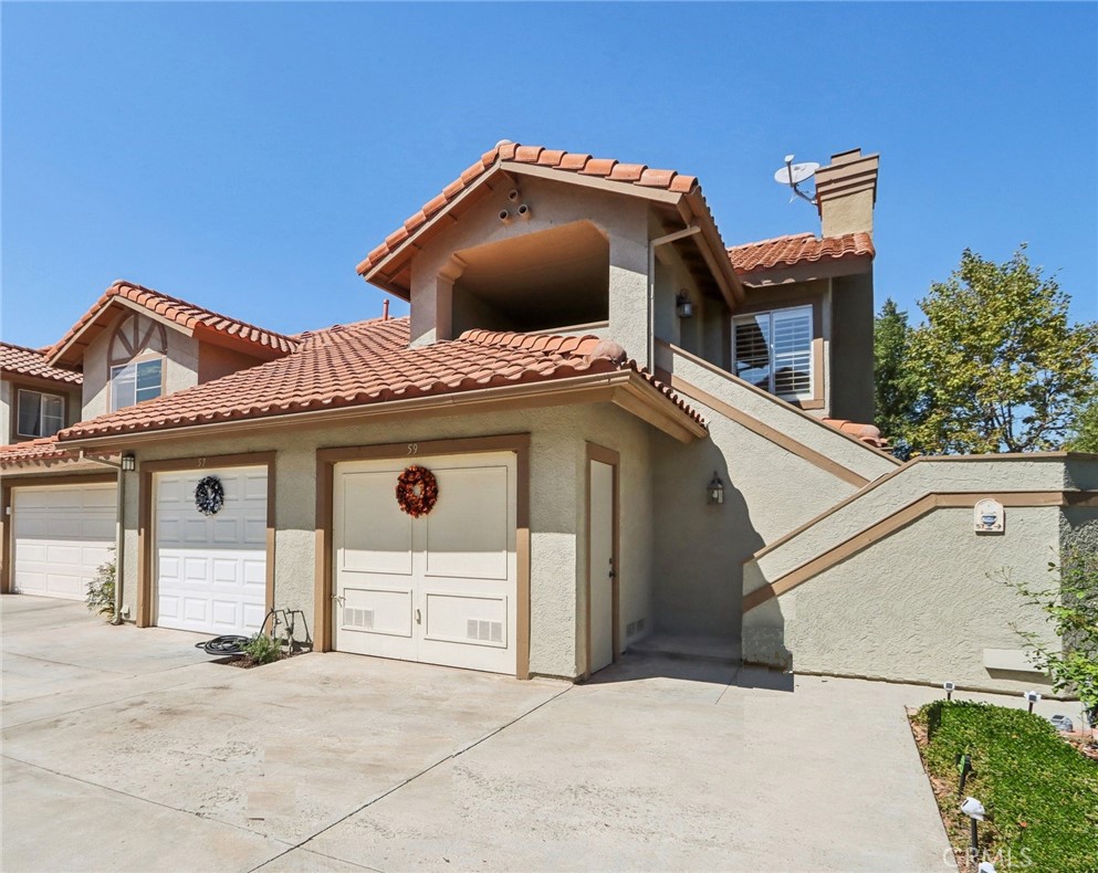 a front view of a house with a garage