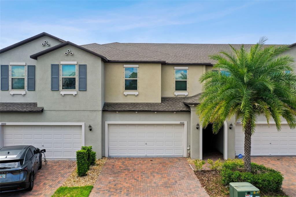 a front view of a house with a garage