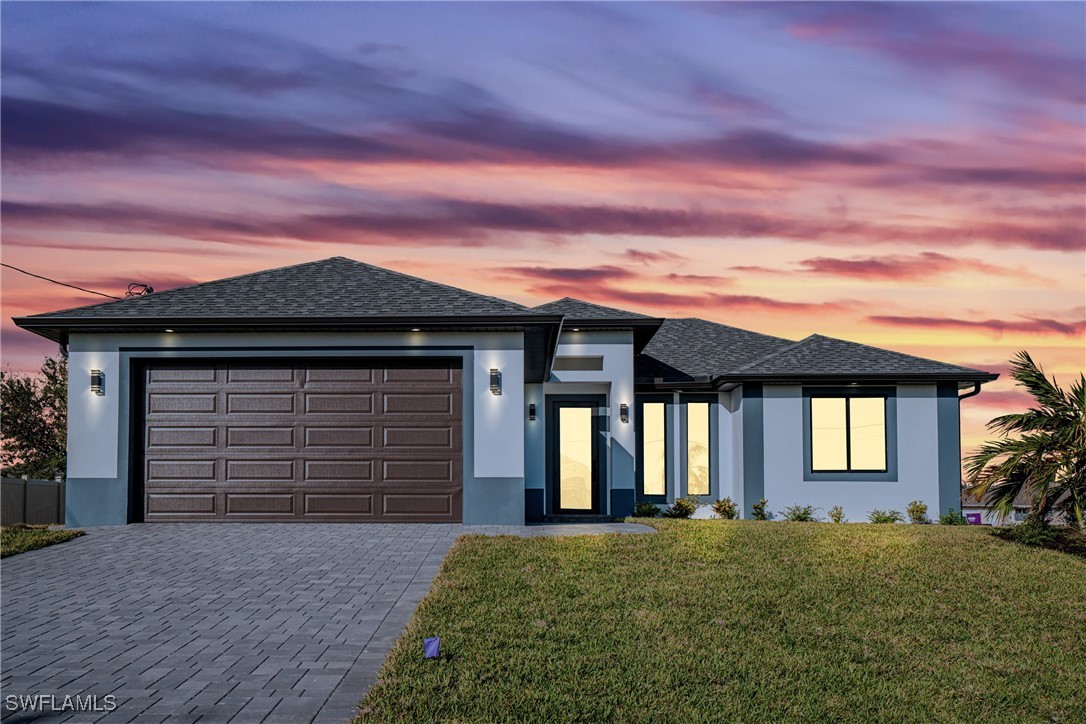 a front view of a house with a yard