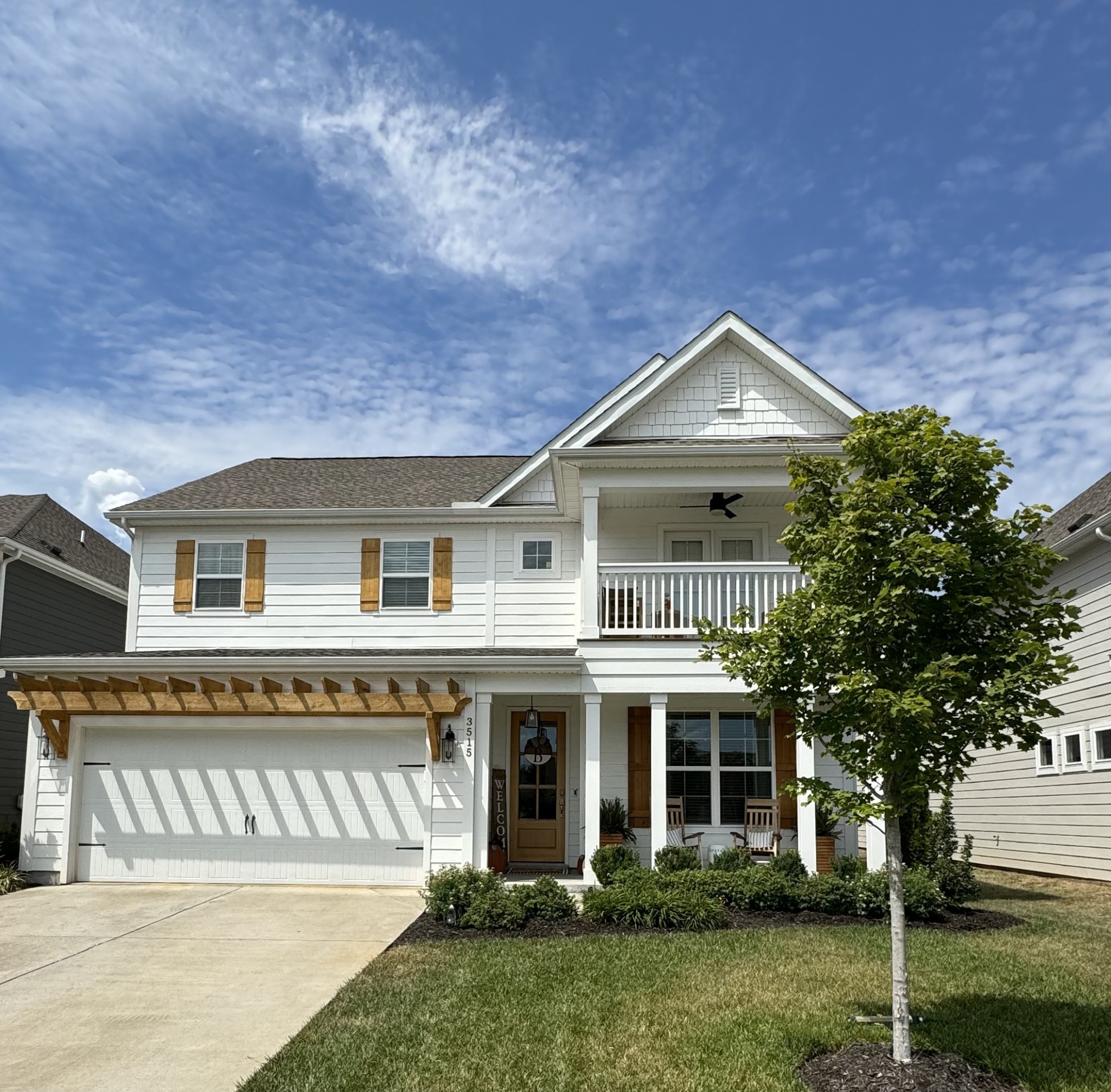 a front view of a house with a garden