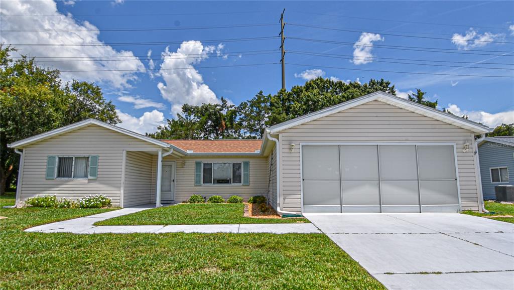 front view of a house with a yard