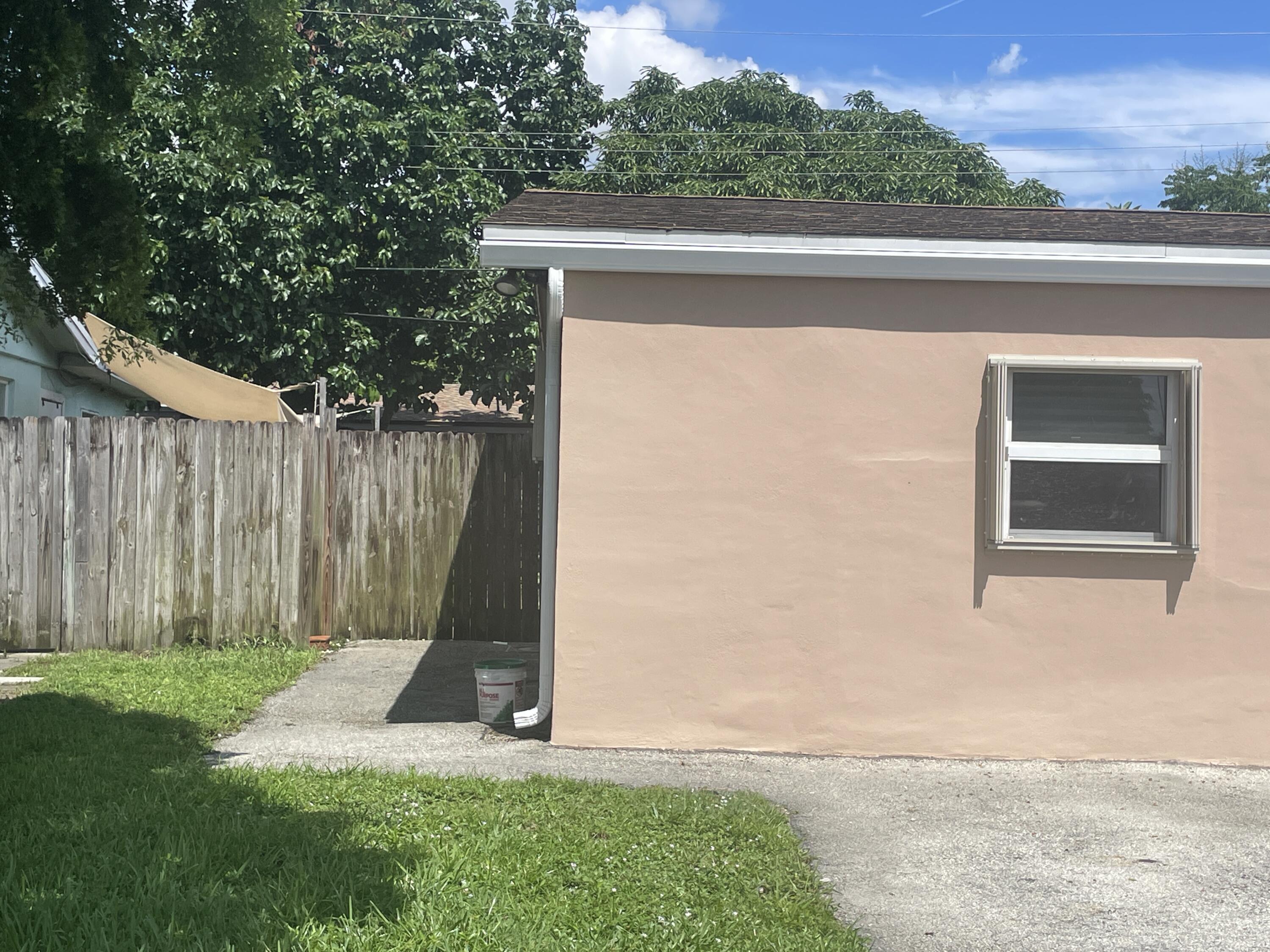 a view of a backyard with a small cabin