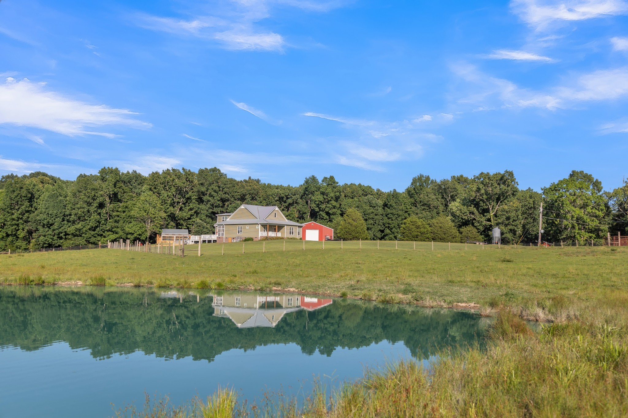 a view of a lake with houses in the back