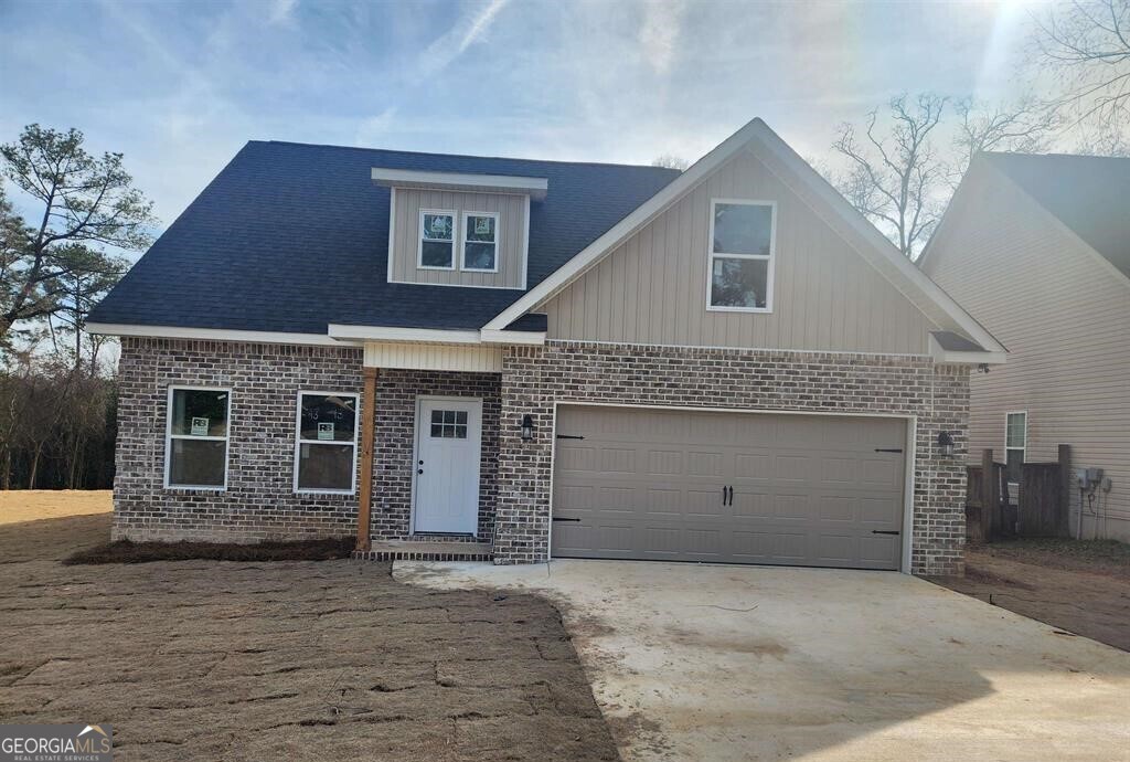 a front view of a house with a garage