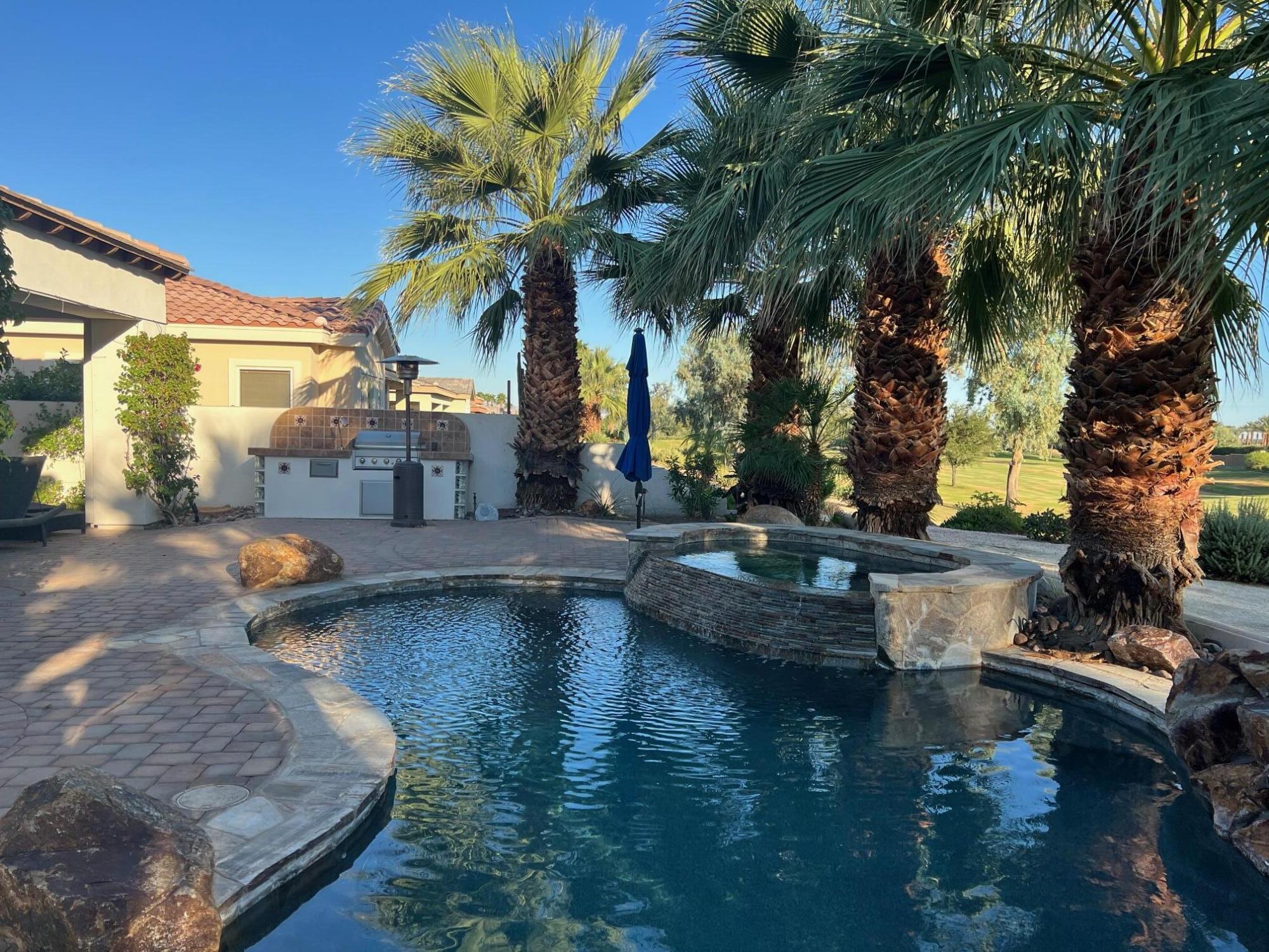 a view of a swimming pool with a patio