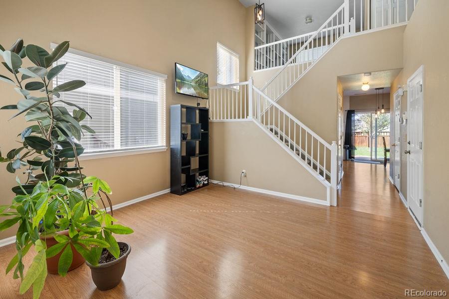 a view of entryway with wooden floor