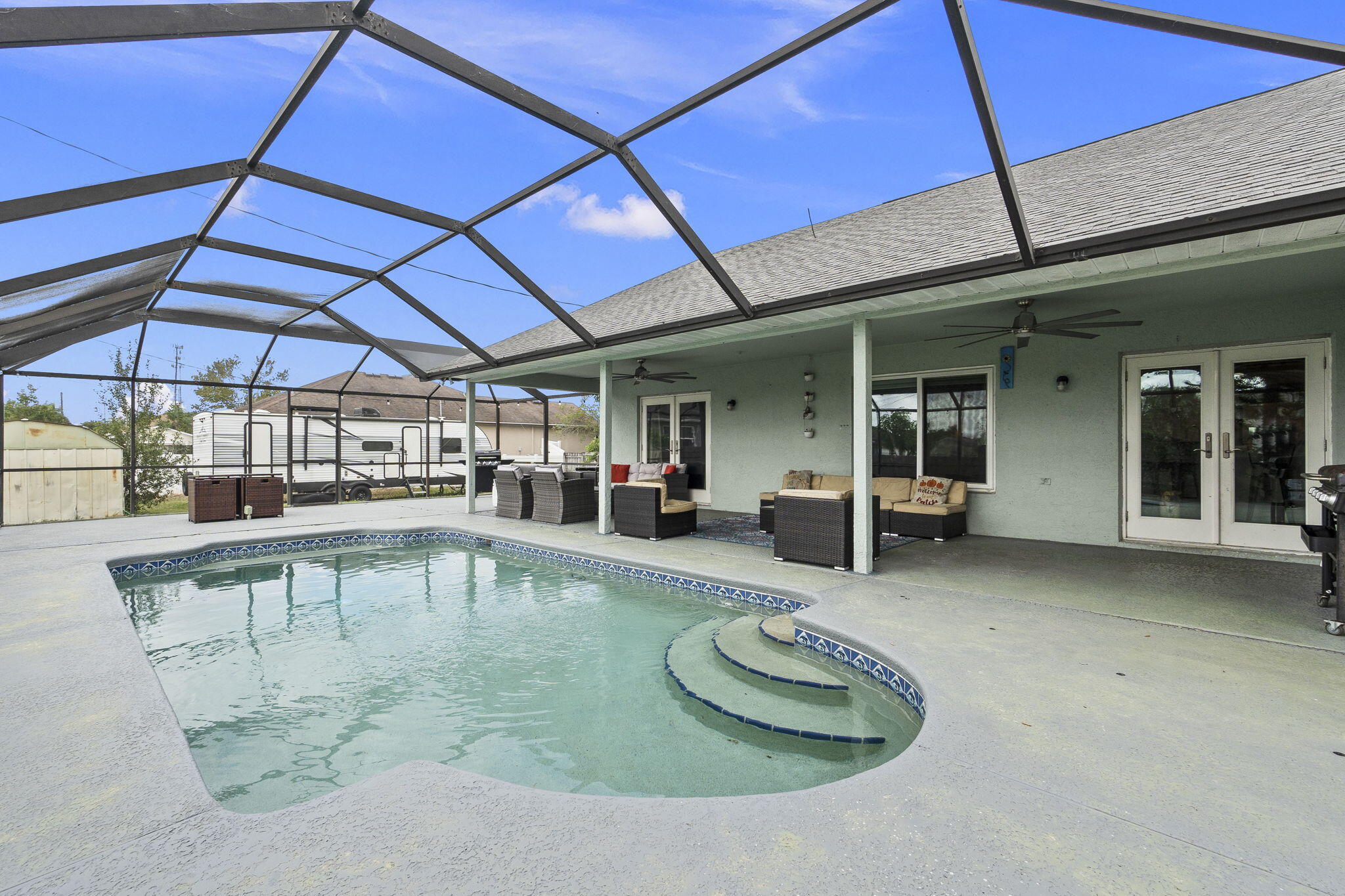 a view of a swimming pool with a patio