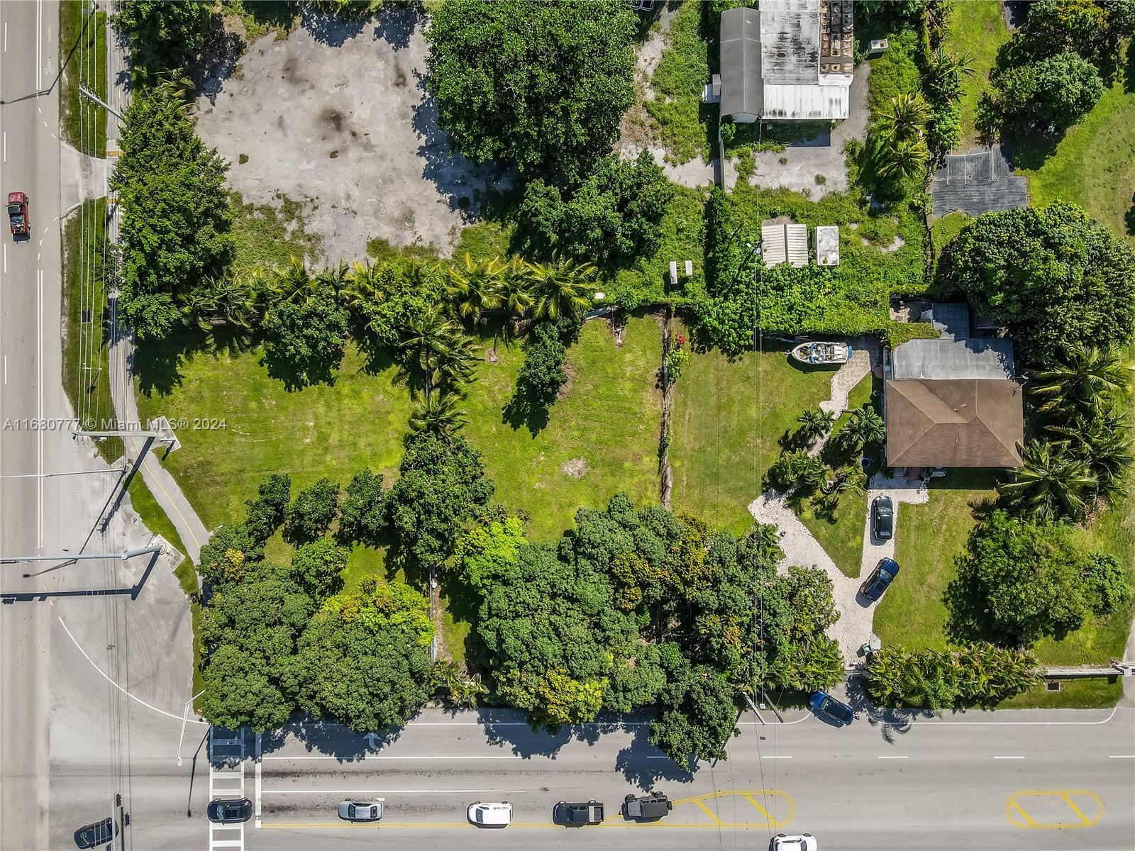 an aerial view of house with yard swimming pool and outdoor seating