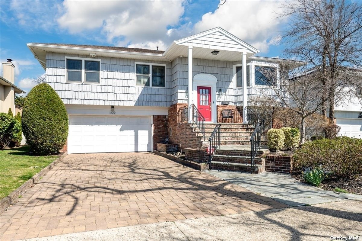 a front view of a house with a garage