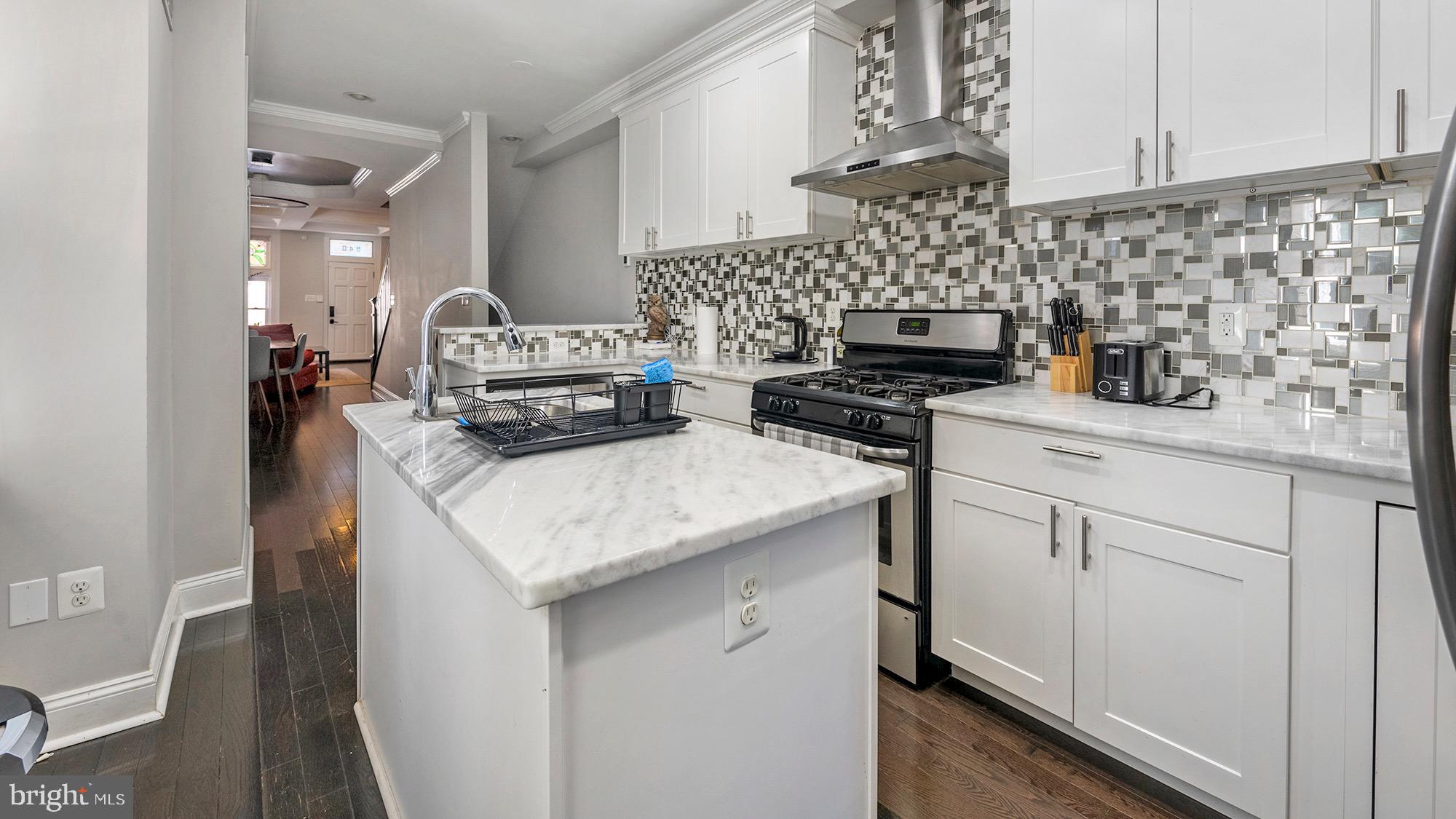 a kitchen with a stove and cabinets