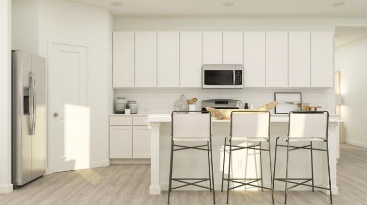 a view of kitchen with white cabinets and stainless steel appliances