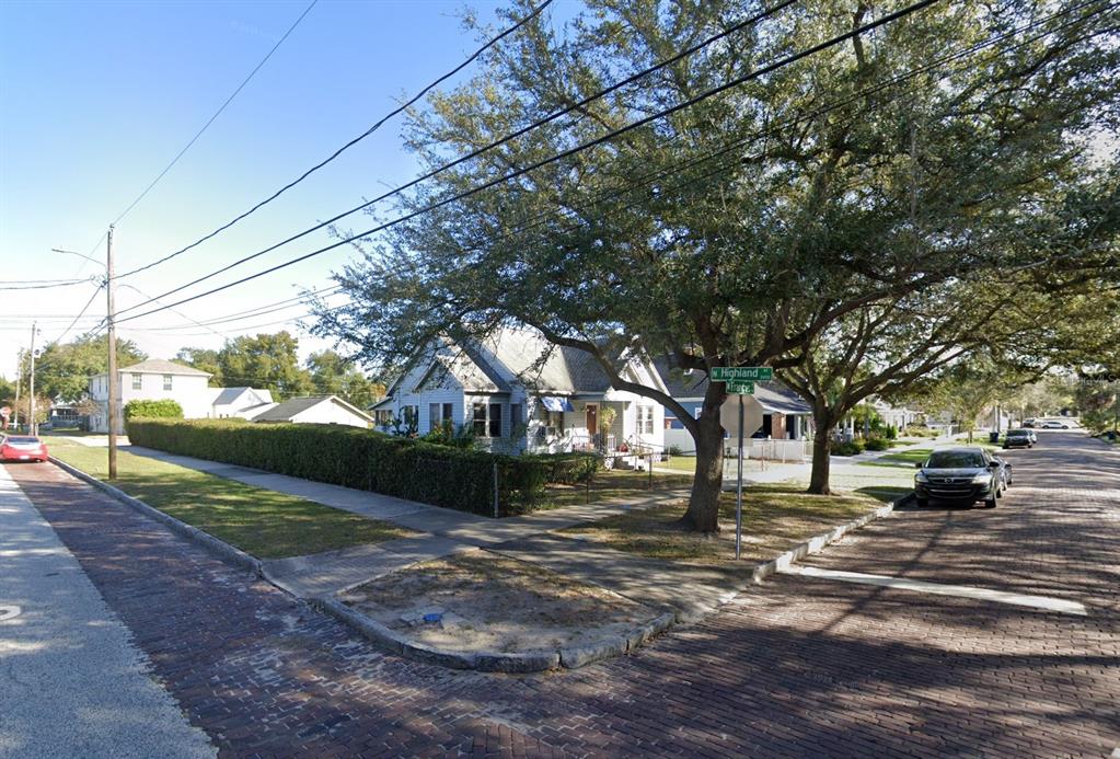 a view of street with large trees