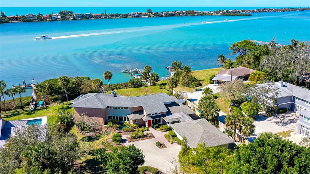 an aerial view of a house with ocean view