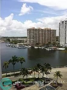 a view of a lake and tall building