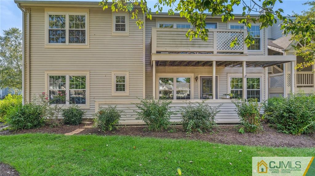 a front view of a house with garden and porch