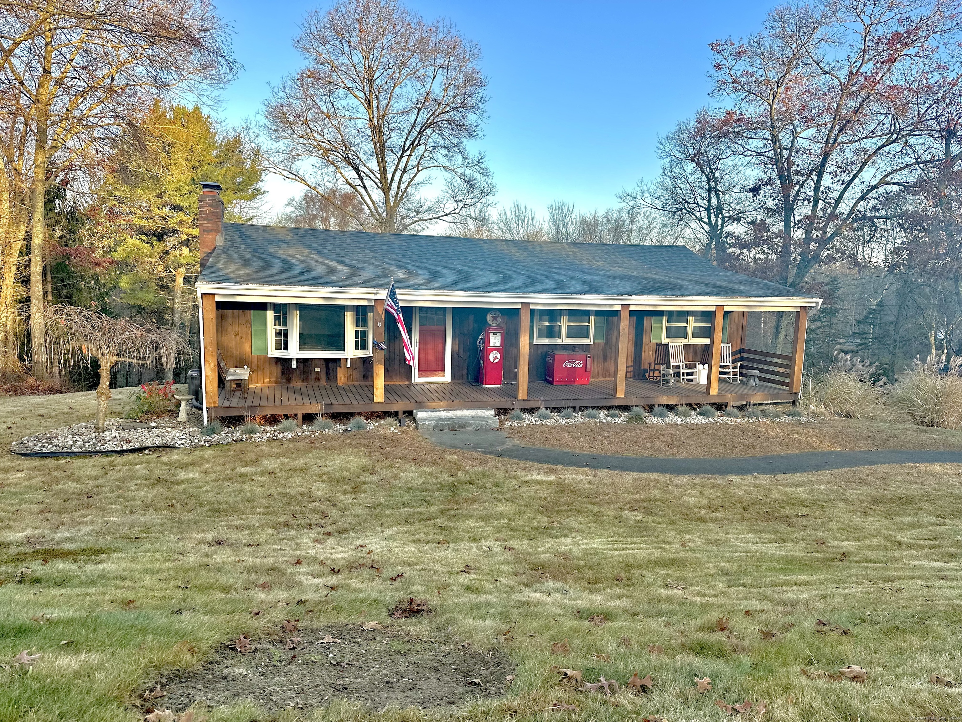 a view of house with outdoor space and swimming pool