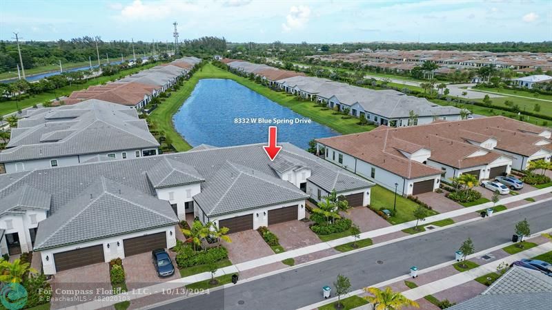 an aerial view of house with a garden