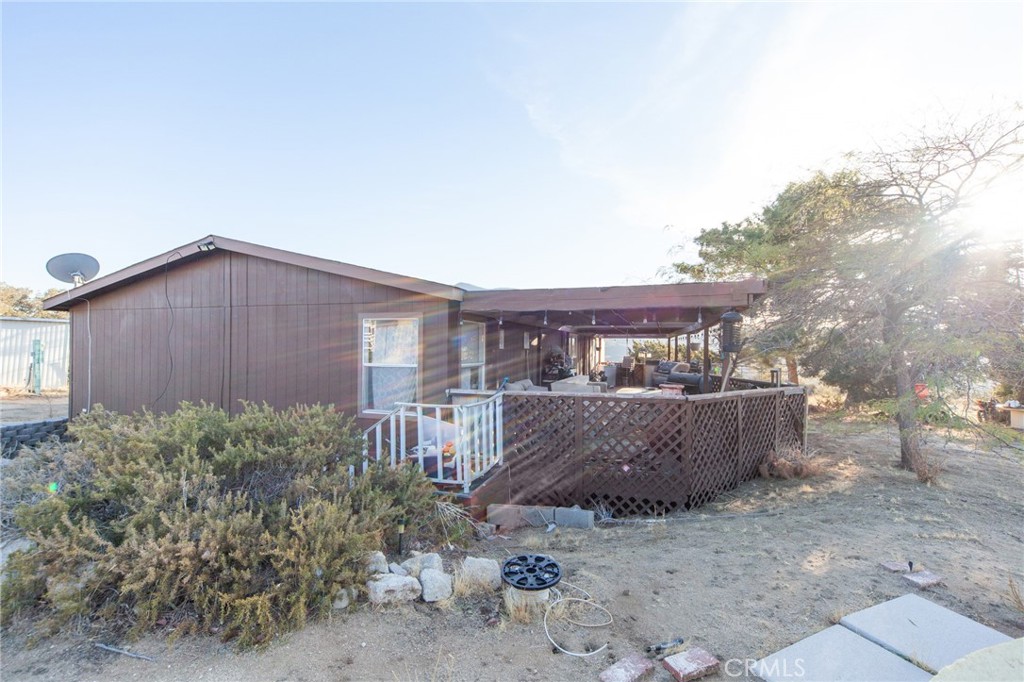 a view of house with backyard