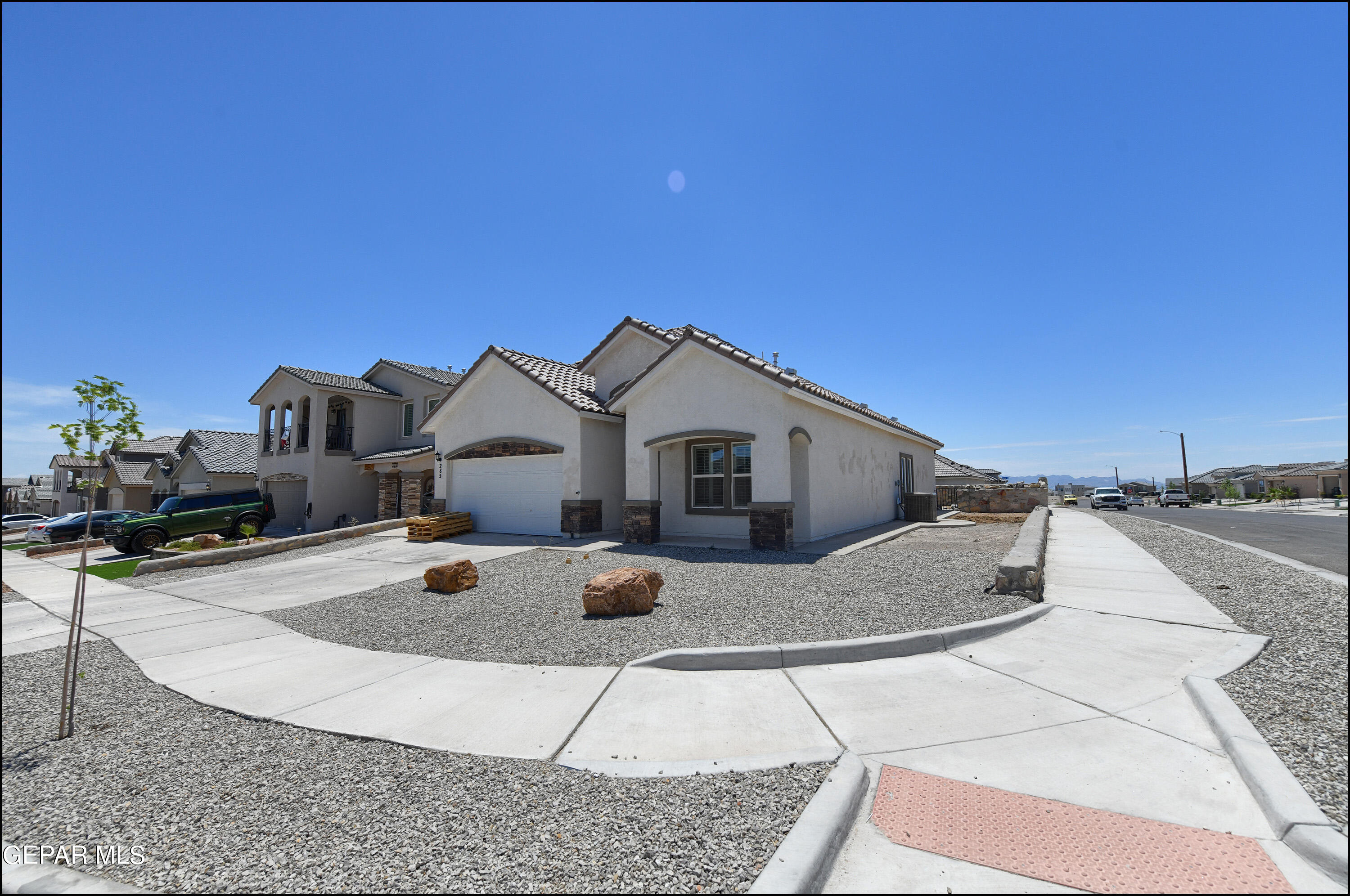 a front view of a house with yard