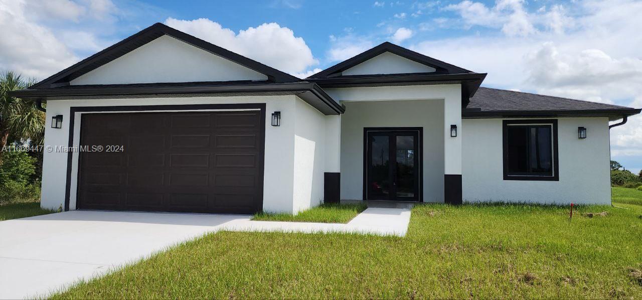 a front view of a house with yard