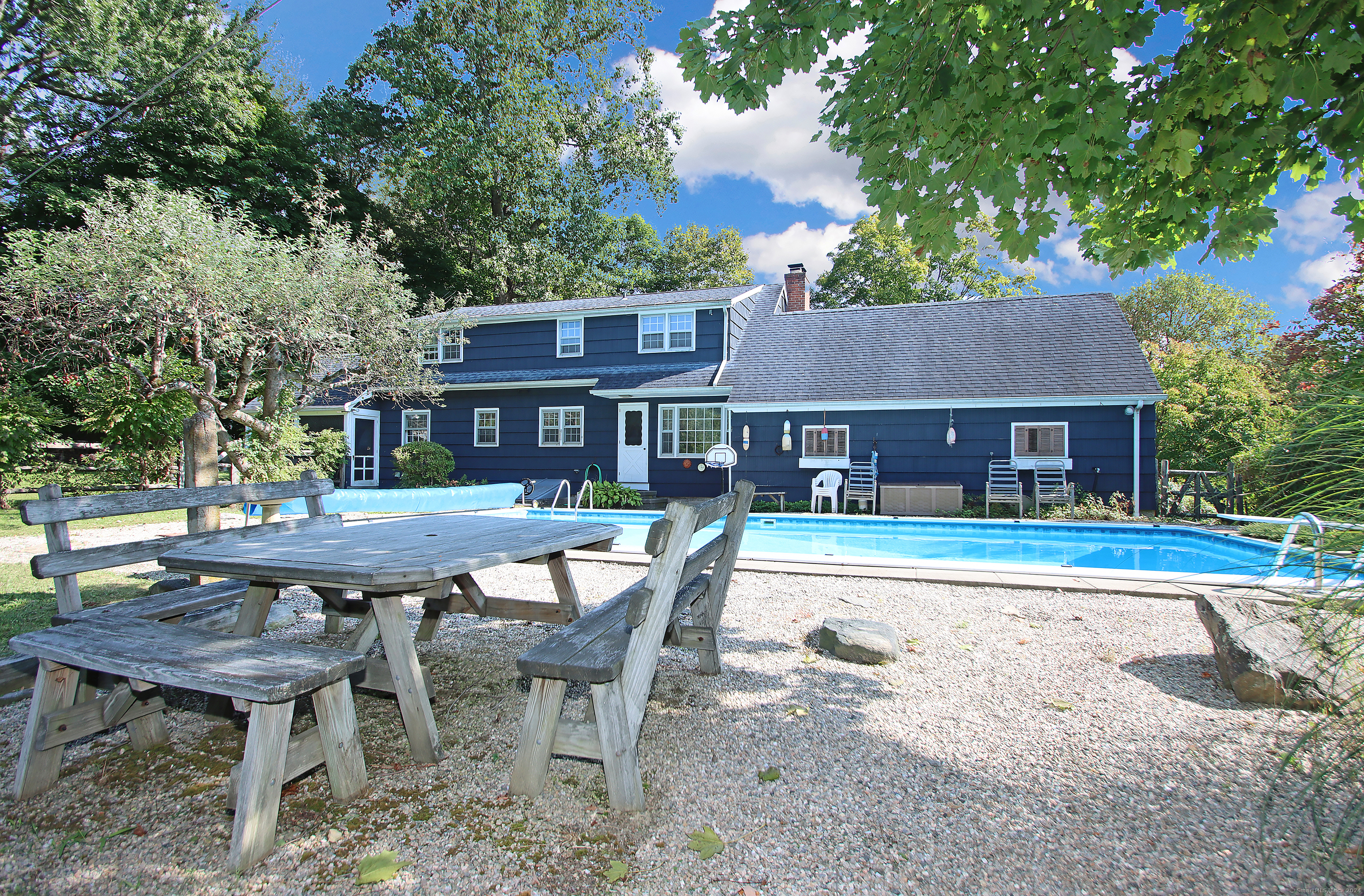 Back view of home with pool