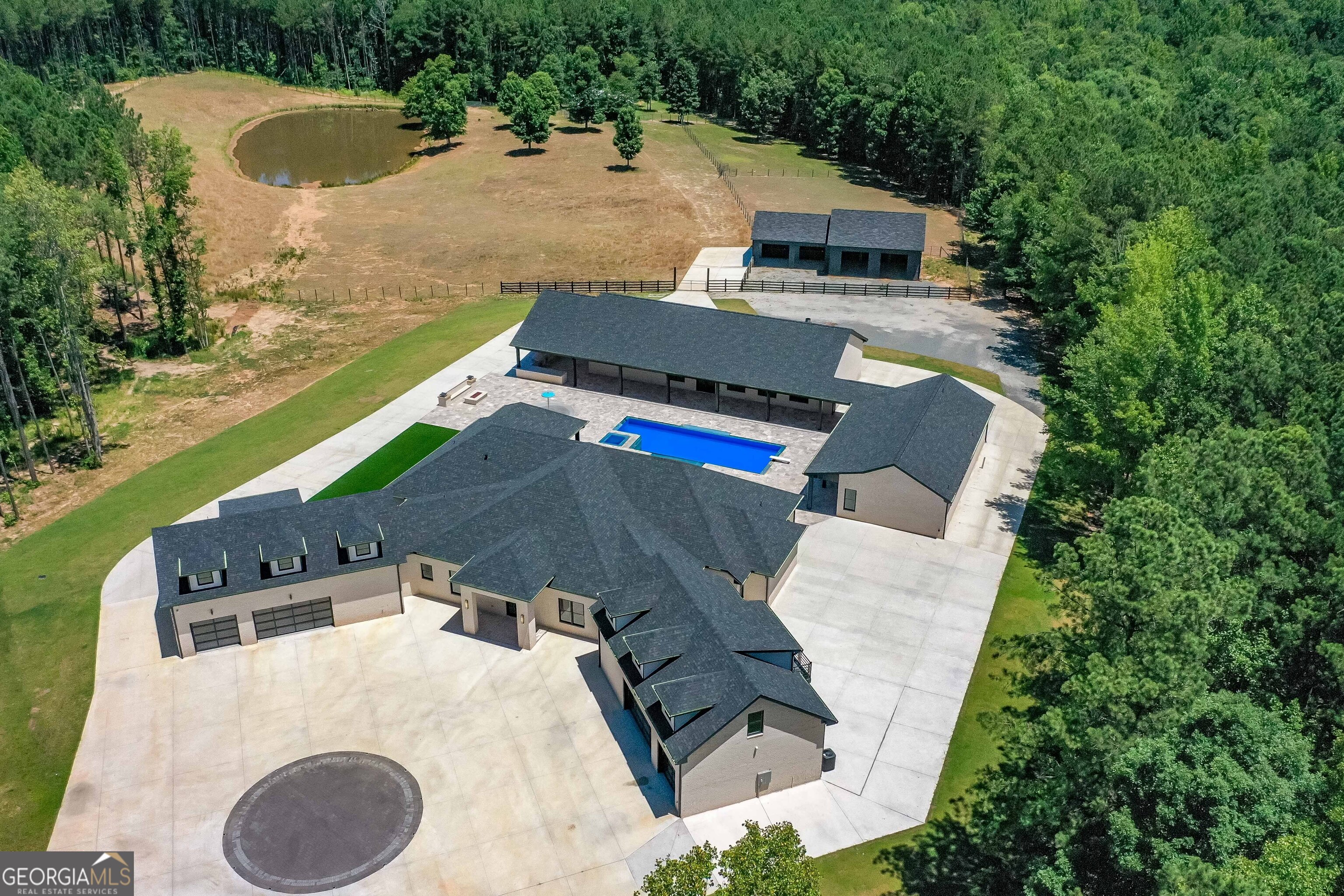 an aerial view of a house with outdoor space