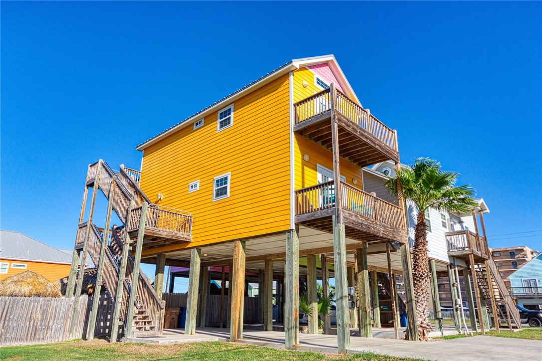 a view of a house with a palm tree