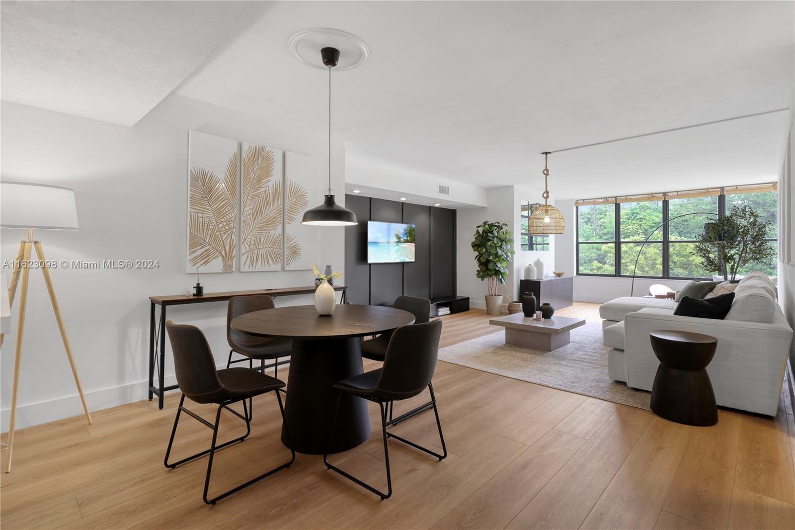 a view of a dining room with furniture window and wooden floor