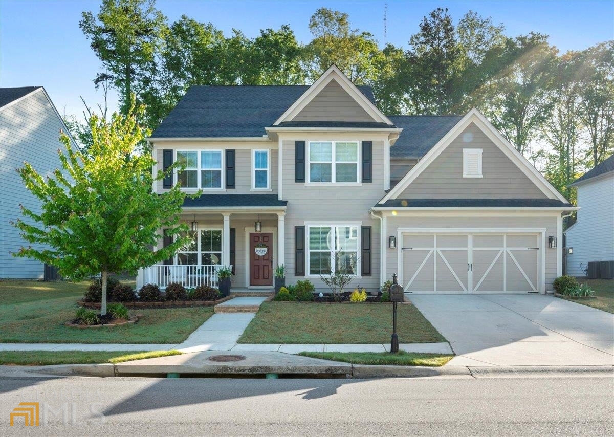 a front view of a house with a yard