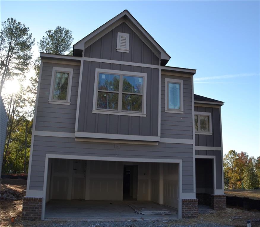 a front view of a house with yard