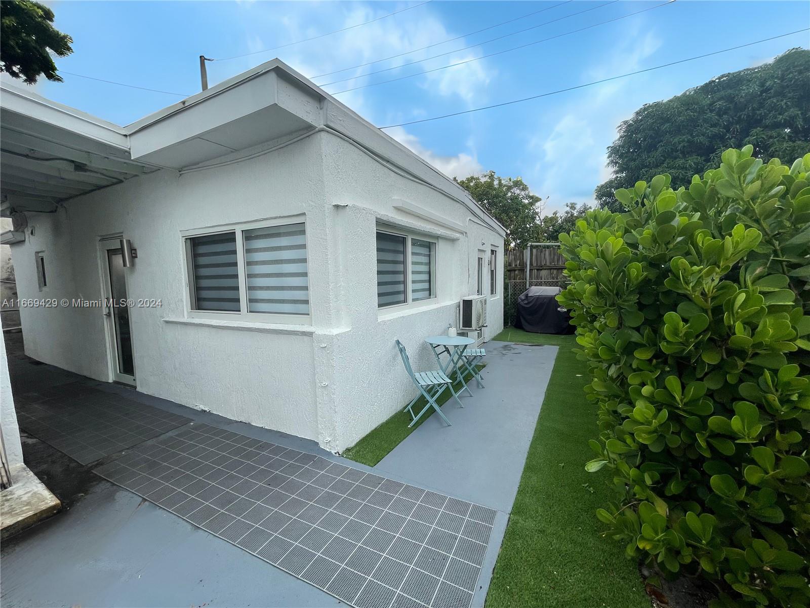 a house view with a garden space