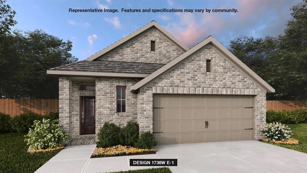 a front view of a house with a garage