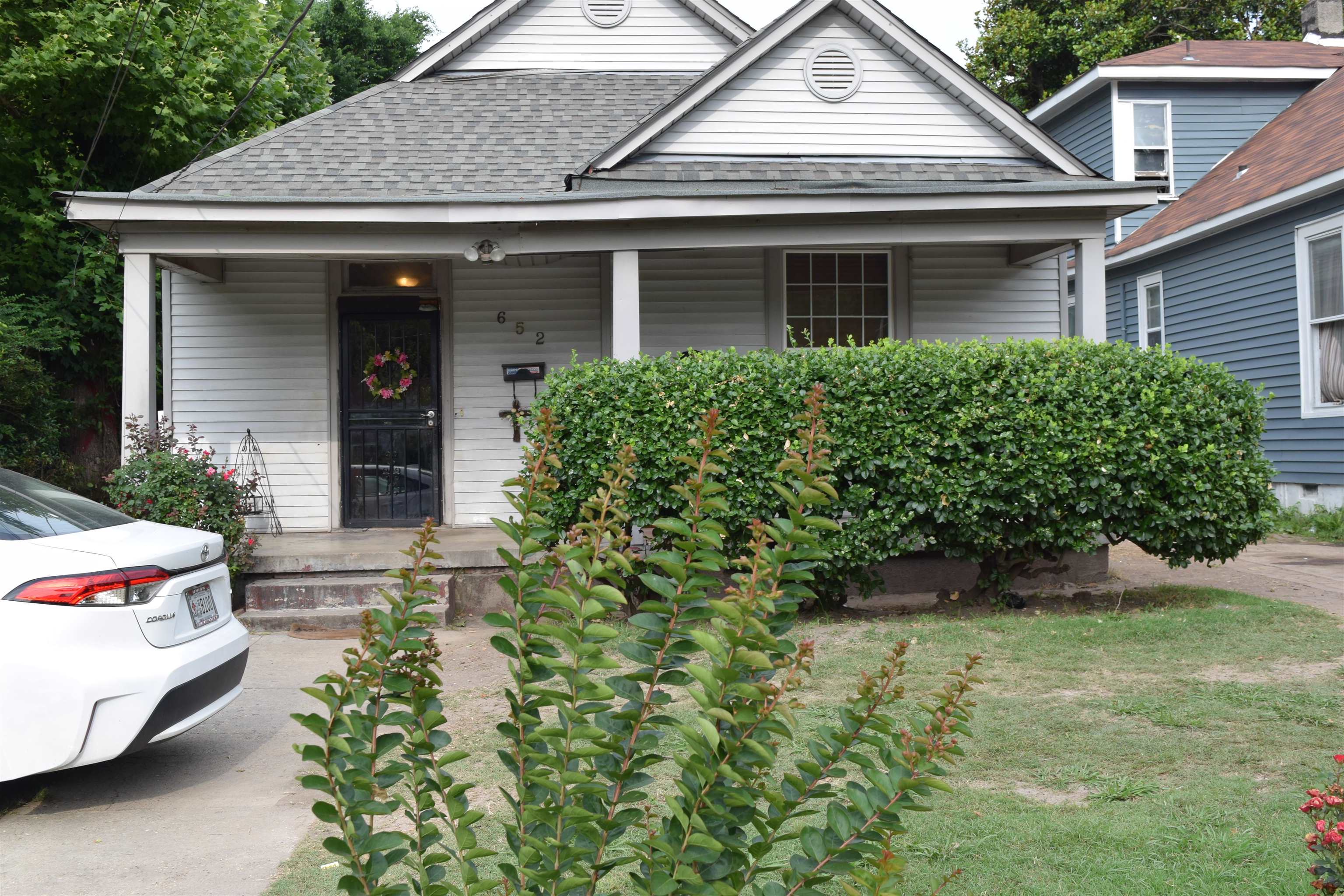 a front view of a house with garden