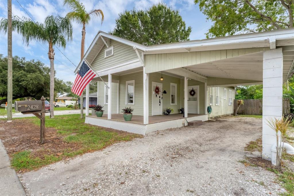 a view of a house with a yard and plants