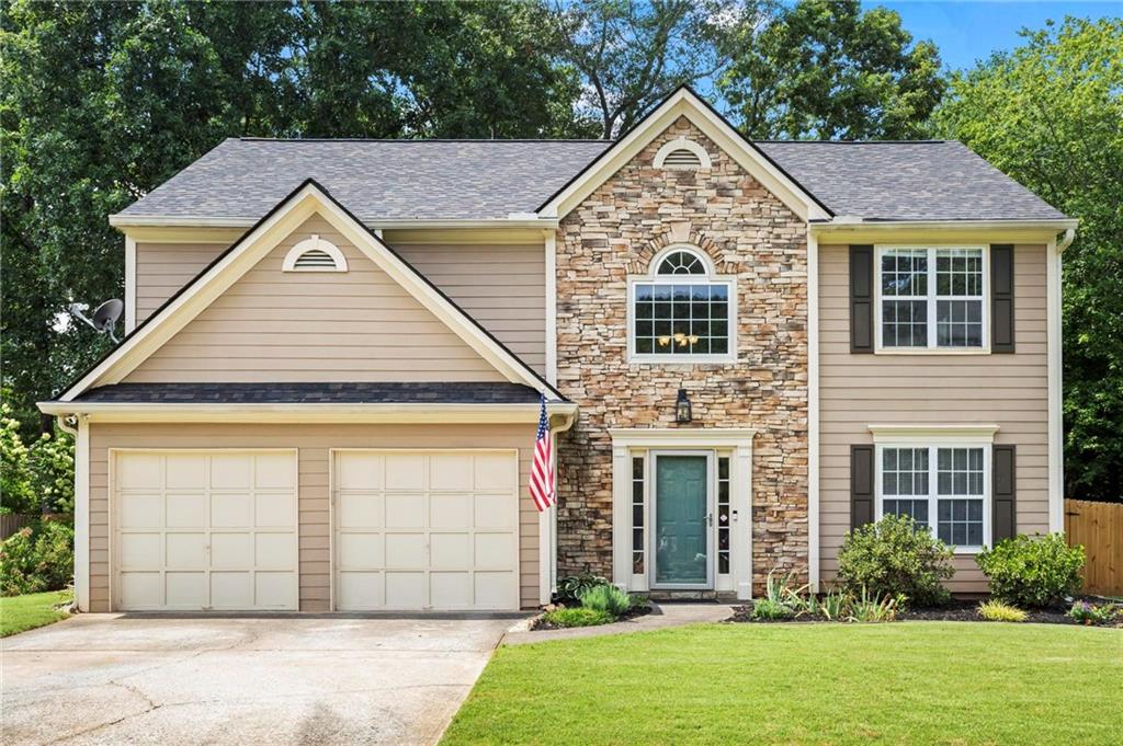 front view of a house with a yard