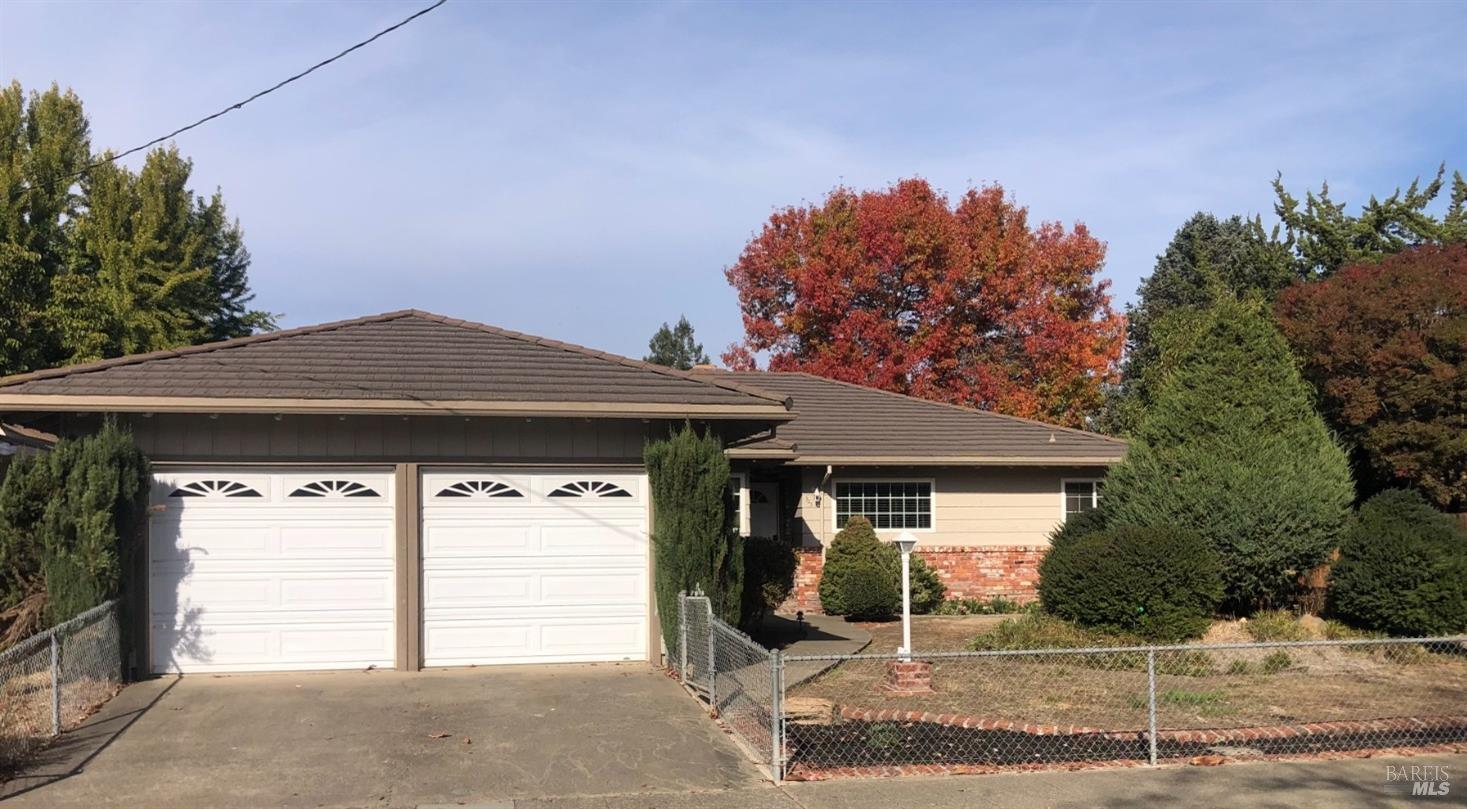 a front view of a house with a garage