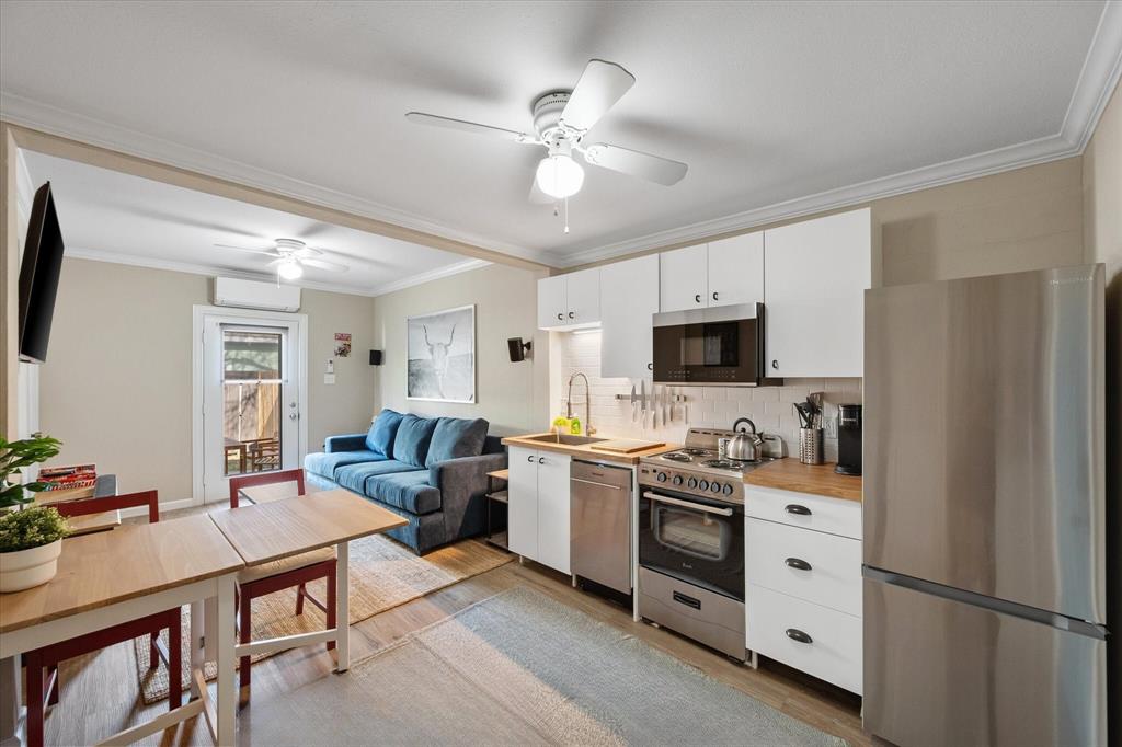 a kitchen with a refrigerator stove and microwave