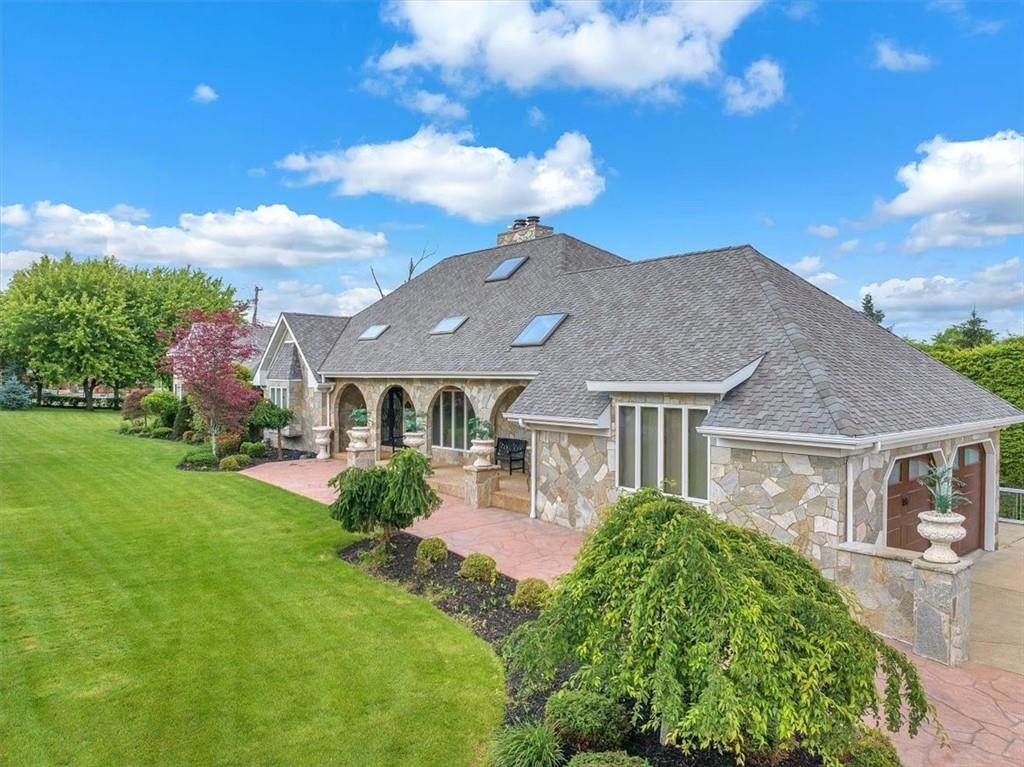 a front view of a house with garden