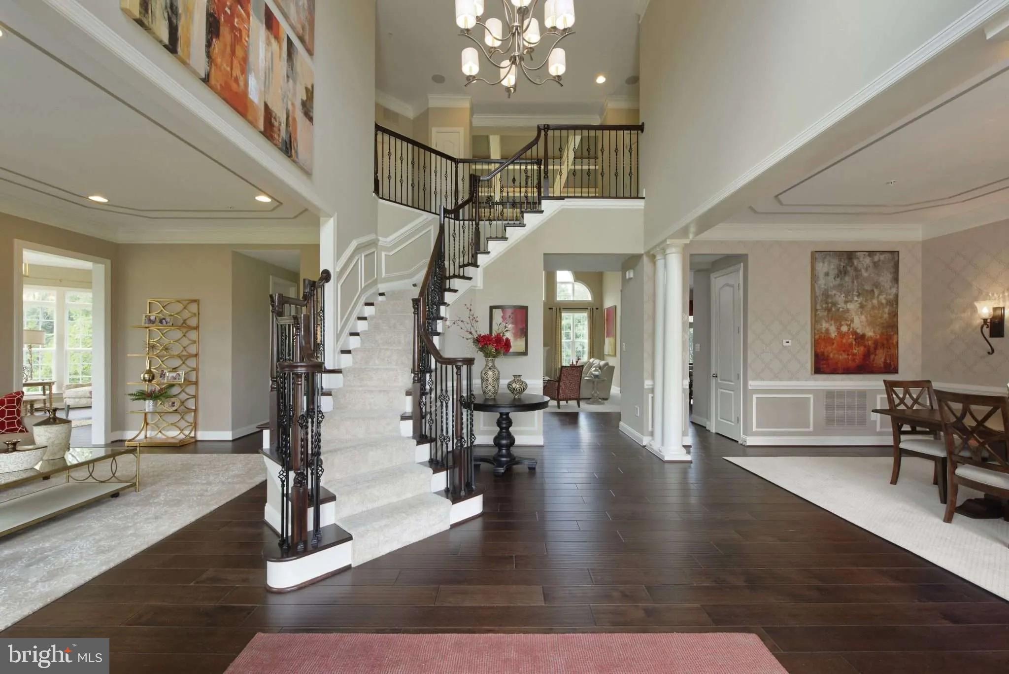 a view of an entryway with wooden floor and windows