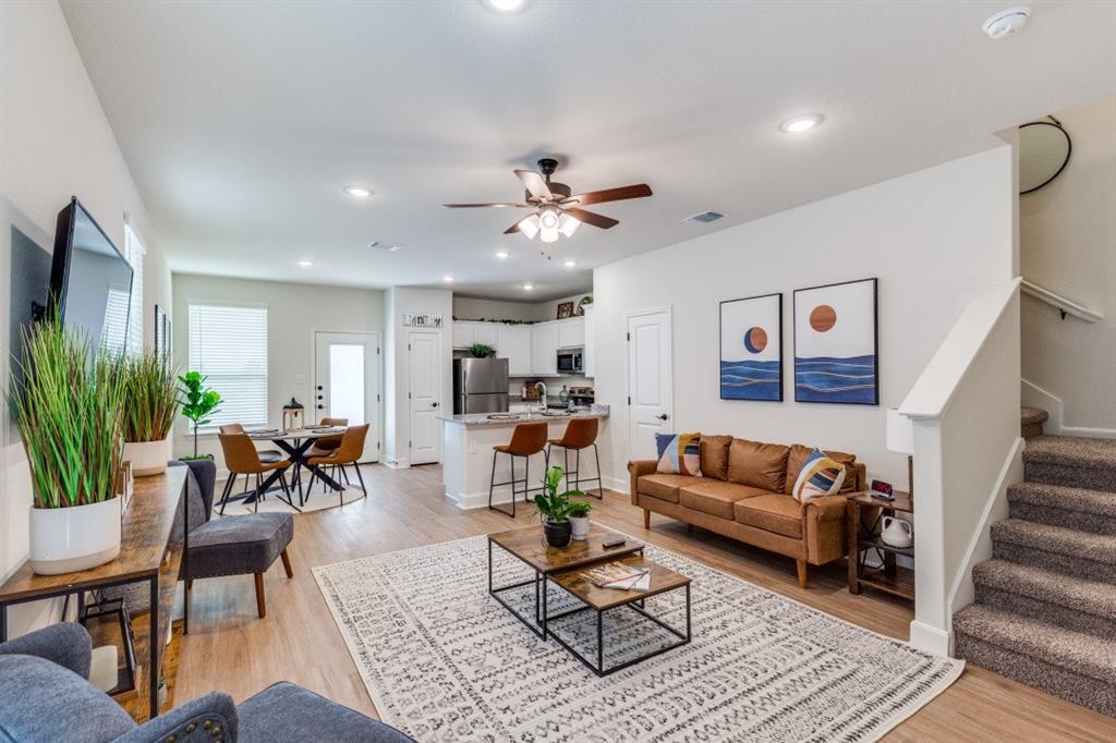 a living room with furniture or couch and a potted plant