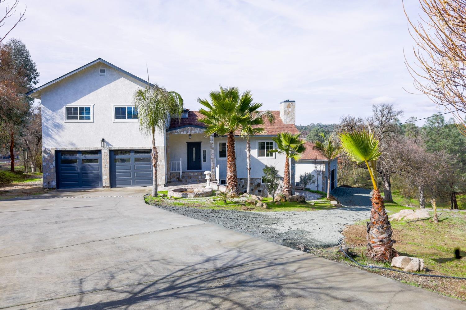 a view of house with outdoor space and entertaining space