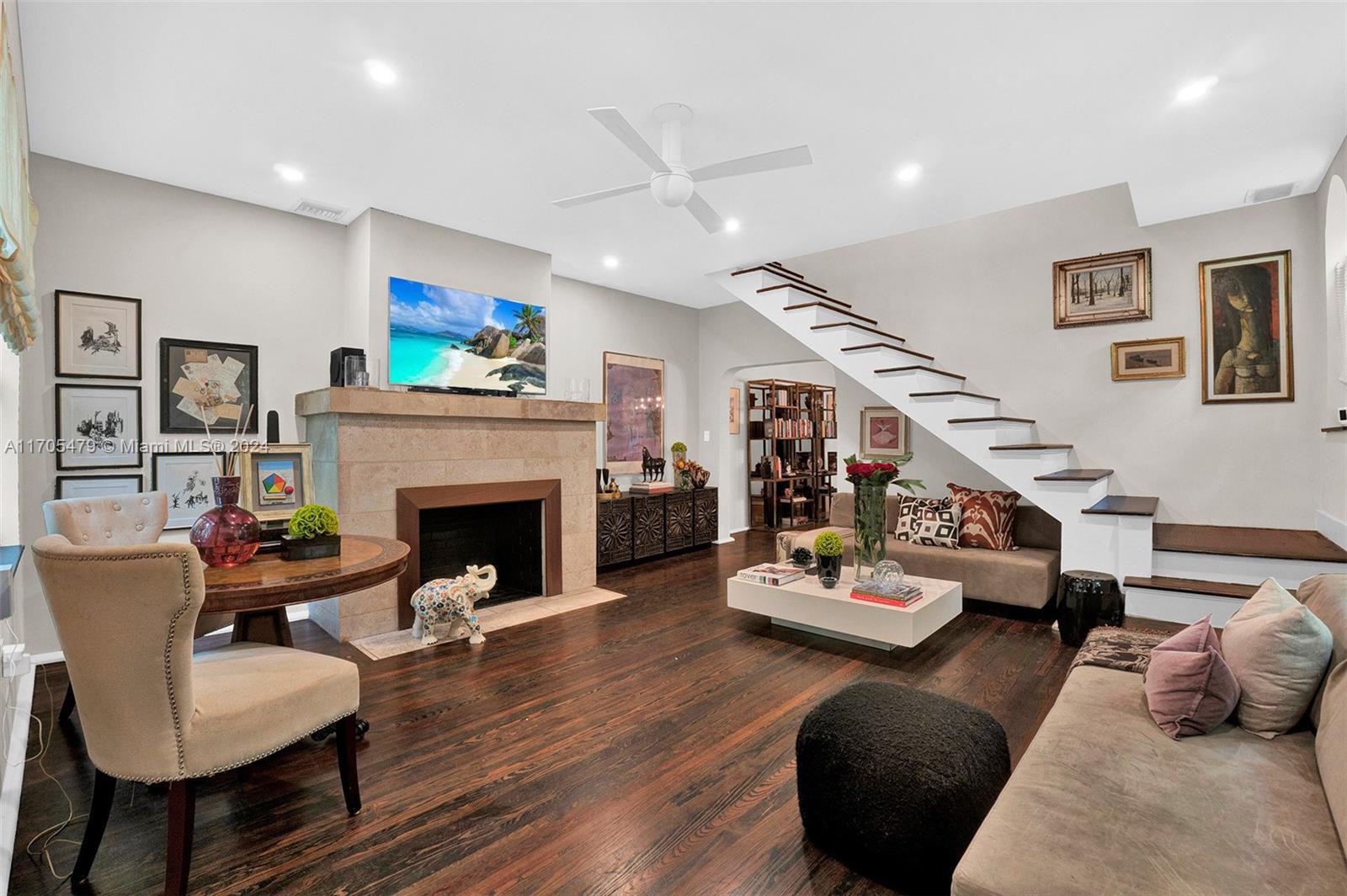 a living room with furniture and a fireplace