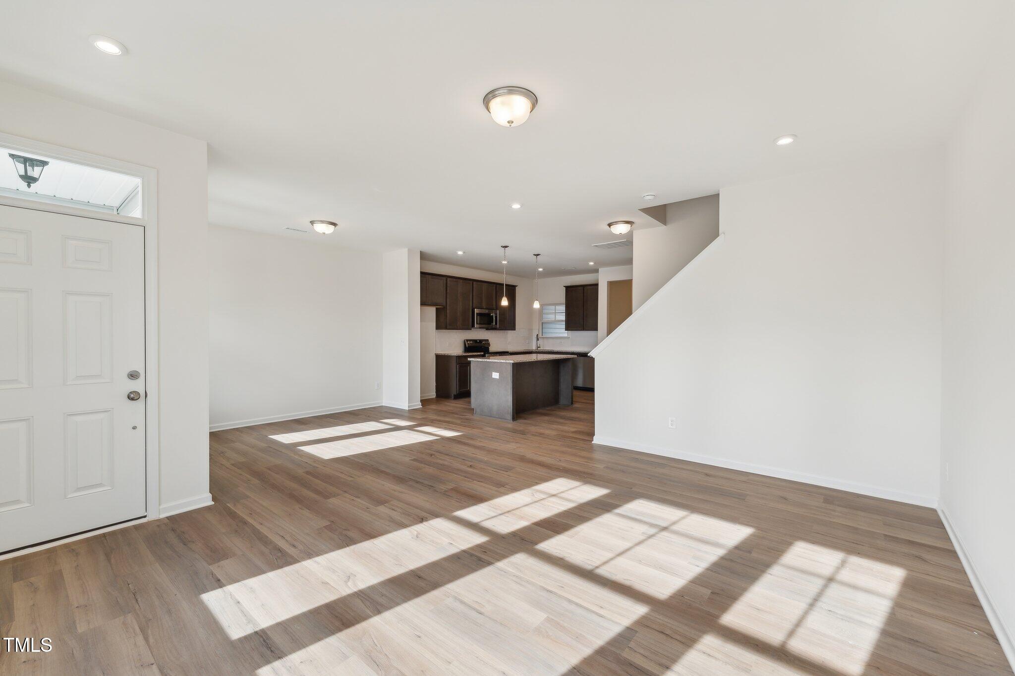 a view of kitchen with wooden floor