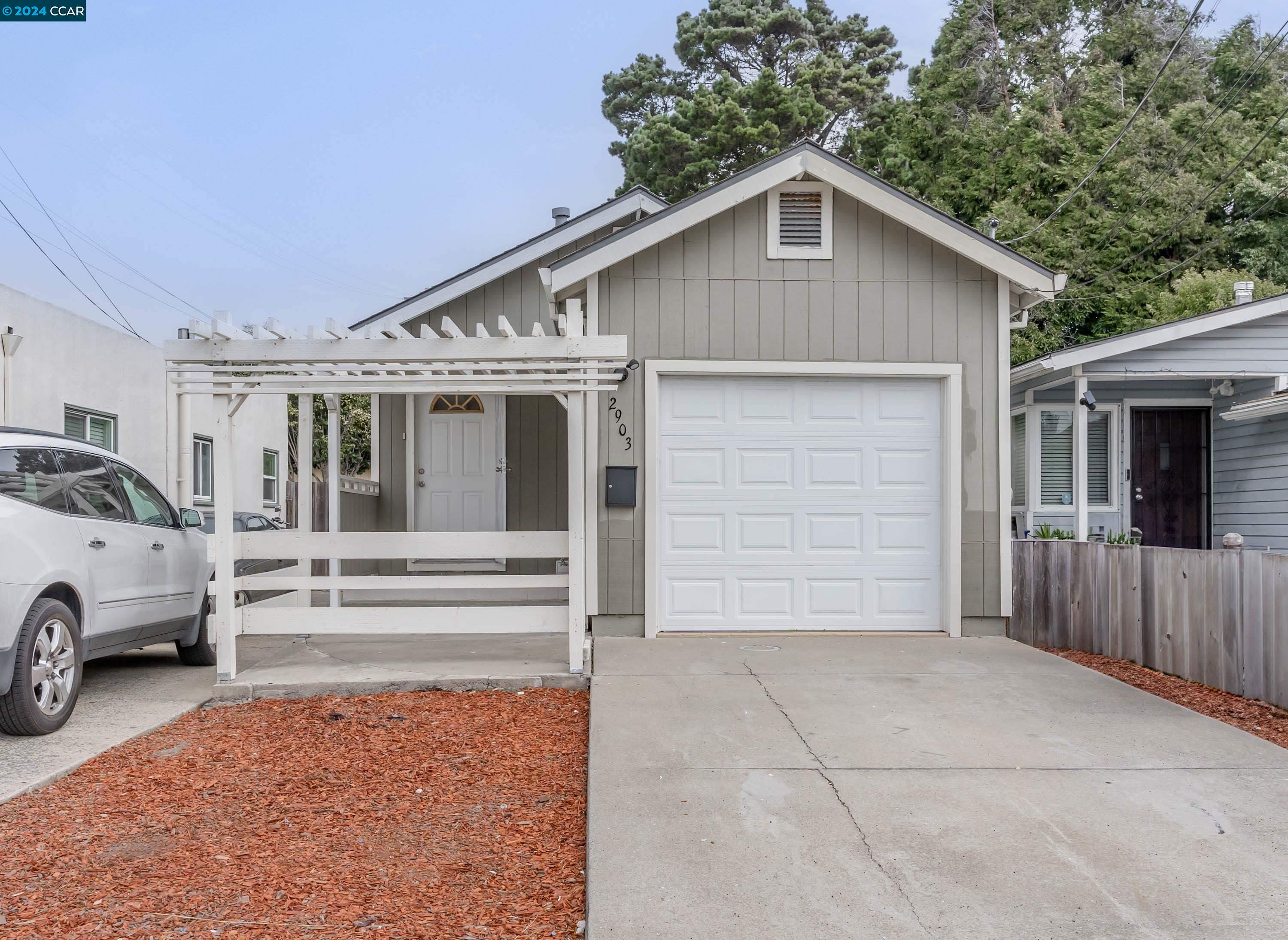 a front view of a house with a garage